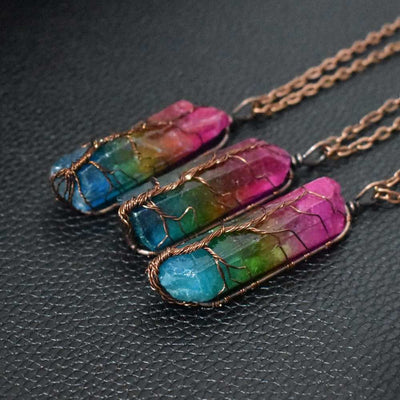 Rainbow-colored stone crystal pillar pendant necklaces with intricate wire wrapping on gold chains