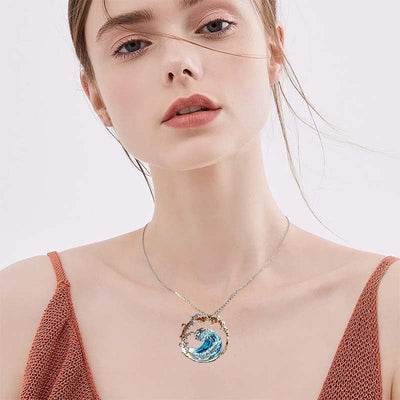 Ocean theme adjustable necklace with copper wave pendant on a regular chain worn by woman